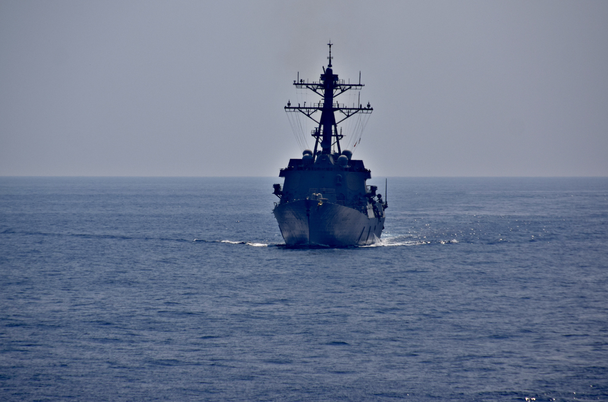 The guided-missile destroyer USS Preble approaches the amphibious assault ship USS Wasp in preparation for fueling at sea during Exercise Balikatan 2019 in the South China Sea on April 6. | U.S. NAVY