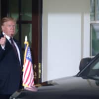 U.S. President Donald Trump gives a thumbs up as Hungary\'s Prime Minister Viktor Orban departs the White House in Washington Monday. | REUTERS