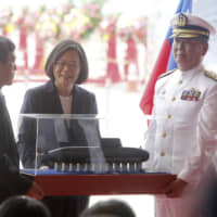 President Tsai Ing-wen looks at a model of Taiwan\'s first indigenous submarine during a groundbreaking ceremony for the island\'s naval submarine factory in Kaohsiung on Thursday. | AP