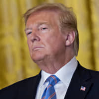 U.S. President Donald Trump listens during a Celebration of Military Mothers event held in the East Room of the White House on Friday. | BLOOMBERG