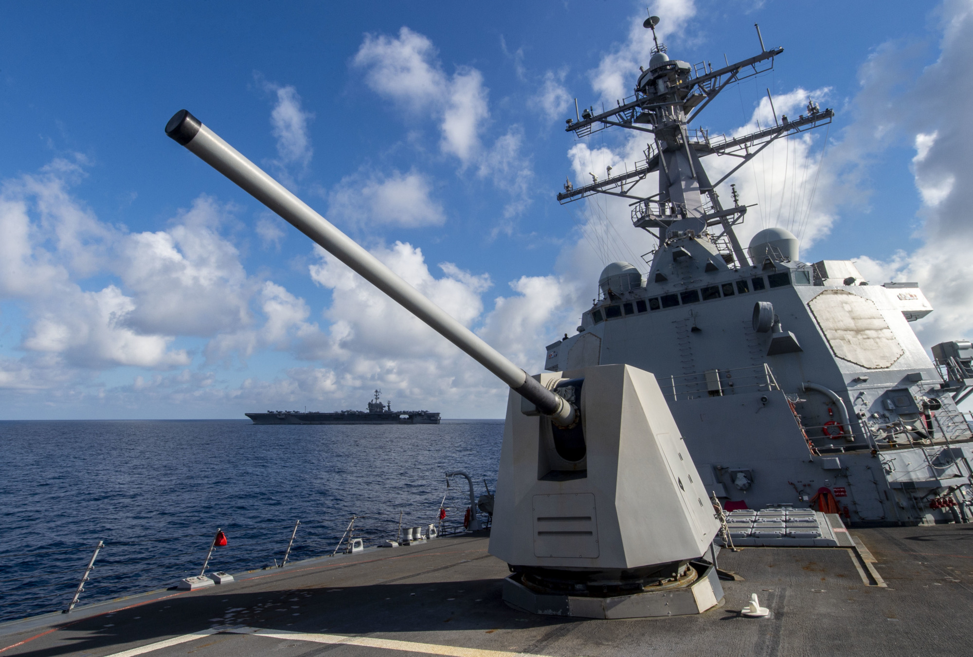 The guided-missile destroyer USS Preble changes course after transiting beside the aircraft carrier USS John C. Stennis during flight operations in the Pacific Ocean in February. | U.S. NAVY