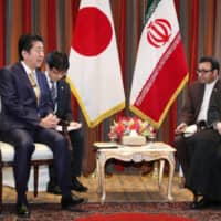 Prime Minister Shinzo Abe and Iranian President Hassan Rouhani hold talks in New York in September. | POOL / VIA KYODO
