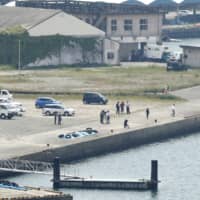 Four people were confirmed dead Monday after their bodies were discovered in a submerged car off a port in Kagoshima Prefecture. | KYODO