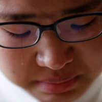 Miwa Moriya cries during an interview at her home in Yokohama on April 24. | REUTERS
