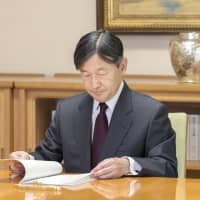 In this handout photo taken Tuesday, Emperor Naruhito carries out his first regular duties in his new role at the Imperial Palace in Tokyo. | IMPERIAL HOUSE AGENCY/ VIA KYODO