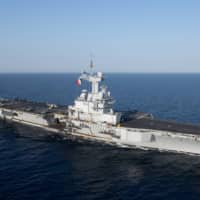 The French Navy\'s aircraft carrier Charles de Gaulle transits the Red Sea on April 15. | U.S. NAVY