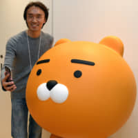 Jay Kim, head of Kakao Japan Corp., a subsidiary of South Korea\'s Kakao Corp. and operator of the popular manga app Piccoma, poses during an interview in Tokyo\'s Roppongi district last month. | YOSHIAKI MIURA