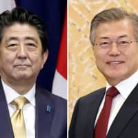 Prime Minister Shinzo Abe and South Korean President Moon Jae-in | KYODO
