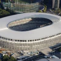 An aerial photo taken Friday shows the New National Stadium in Tokyo\'s Shinjuku Ward. | KYODO