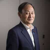 Chief Cabinet Secretary Yoshihide Suga in Tokyo last July | BLOOMBERG