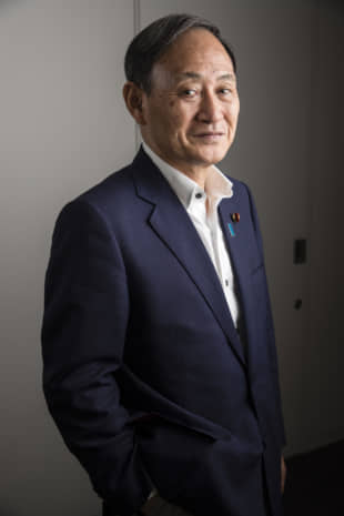 Chief Cabinet Secretary Yoshihide Suga in Tokyo last July | BLOOMBERG