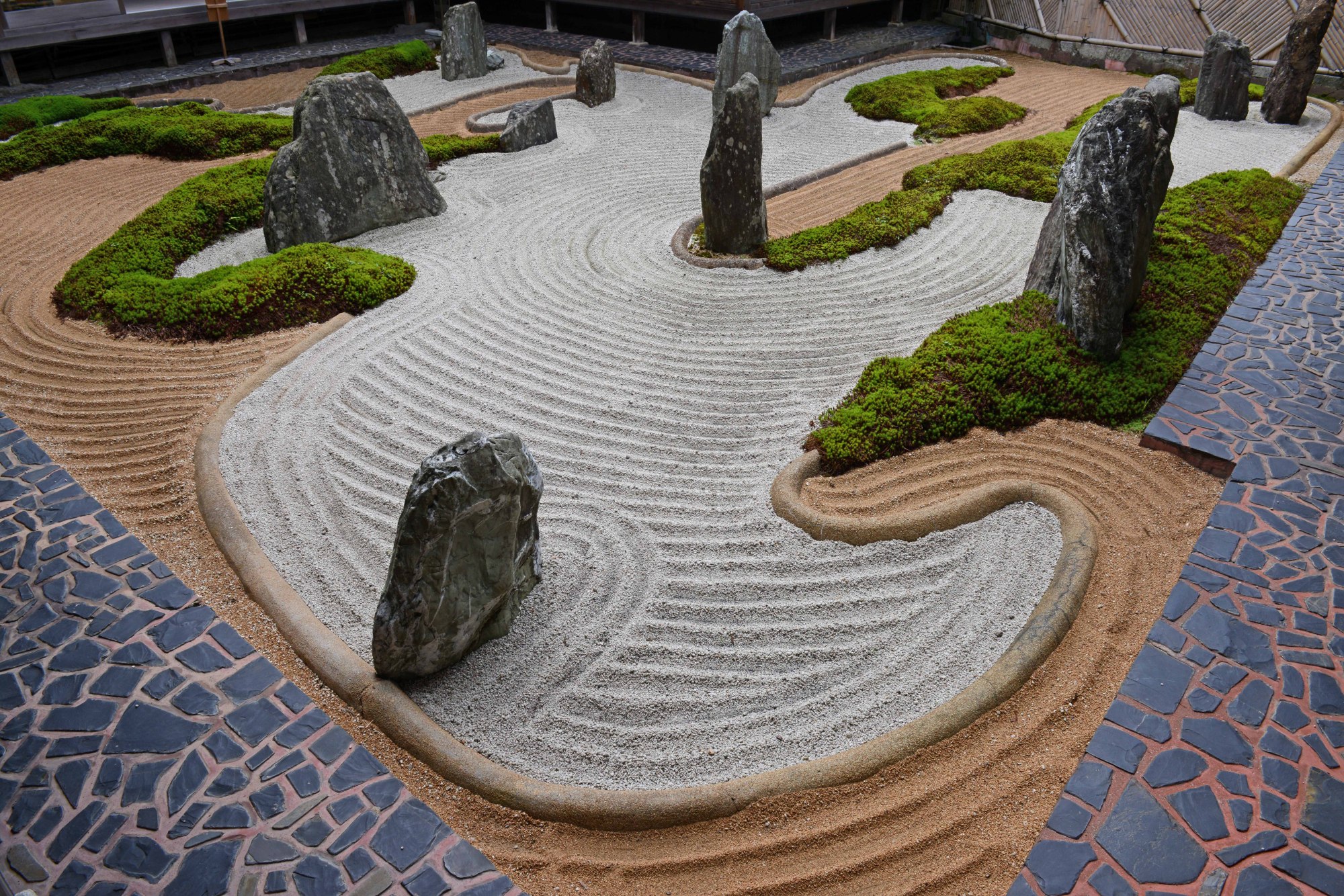 Tile, colored gravel and cement are part of the Mirei Shigemori garden at Fukuchiin in Mount Koya, Wakayama Prefecture. | STEPHEN MANSFIELD
