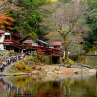 Little outpost of civilization: Visitors wait just outside the rustic Kurofuchi-so teahouse, which sells freshly caught grilled ayu sweetfish. | ANGELES MARIN CABELLO