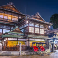 Lights, camera, relaxation: The 1,000-year-old Dogo Onsen in Matsuyama was inspiration for the bath houses in \"Spirited Away.\" | GETTY IMAGES
