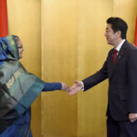 Prime Minister Shinzo Abe welcomes Bangladesh Prime Minister Sheikh Hasina before holding talks on May 28, 2016. The two leaders will meet again this week in Tokyo. | AP