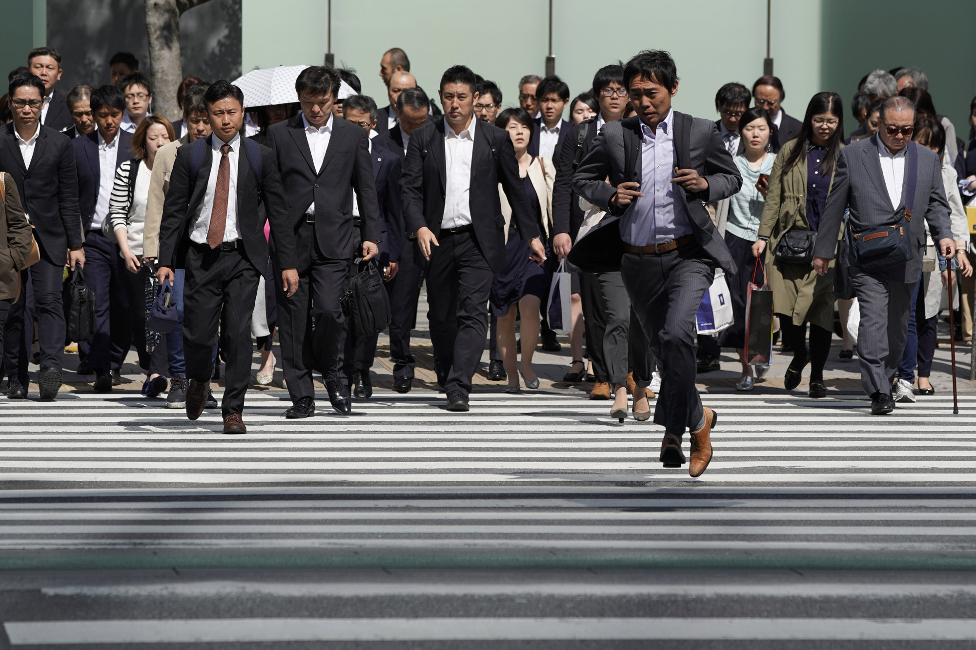 Wage growth remains sluggish for Japanese workers despite the nation's growing labor shortage. | BLOOMBERG