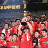 Alvark head coach Luka Pavicevic holds the B. League Championship trophy. | DAN ORLOWITZ