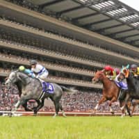 Normcore (4) captures the Victoria Mile at Tokyo Racecourse on Sunday. | KYODO