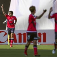 Cerezo Osaka\'s Bruno Mendes celebrates his second-half goal against FC Tokyo on Saturday at Yanmar Stadium. | KYODO