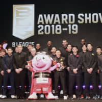 B. League MVP Yuki Togashi (sixth from right) and other award recipients and guests stand on stage at the B. League Award Show at the Roppongi Hills Arena on Wednesday night. | KAZ NAGATSUKA