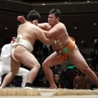 Amateur rikishi compete during a competition on Dec. 4, 2018, at Ryogoku Kokugikan. | KYODO