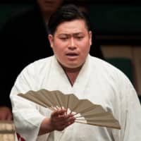 Kohei performs his duties at the 2018 Summer Grand Sumo Tournament at Ryogoku Kokugikan. | JOHN GUNNING
