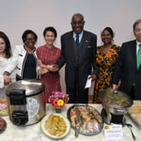 To support the 2019 YMCA International Charity Run, the oldest charity run in Japan, the Cameroonian ambassador and his wife held a charity dinner at the ambassador\'s residence in Nakameguro on April 26. Cameroonian Ambassador Pierre Ndzengue (third from right) and his wife, Alphonsine (second from right), joined (from left) Kazuko Nakajima, president of Sakura Global Club, the official supporter for Japan YMCA; Bekolo Ebe Epse Bebey Ejangue Viviane, first counselor at the Cameroonian Embassy; Yuko Arimori, a Japanese Olympic marathon medalist; and Seiichi Kanzaki, the national general secretary for The National Council of YMCAs of Japan, at the event. | YOSHIAKI MIURA