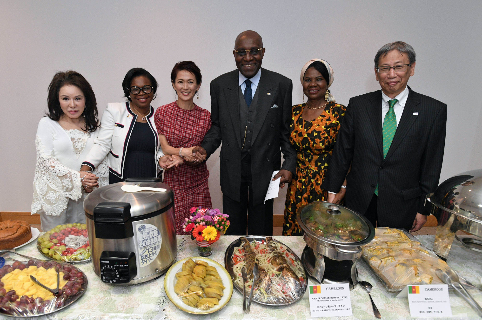 To support the 2019 YMCA International Charity Run, the oldest charity run in Japan, the Cameroonian ambassador and his wife held a charity dinner at the ambassador's residence in Nakameguro on April 26. Cameroonian Ambassador Pierre Ndzengue (third from right) and his wife, Alphonsine (second from right), joined (from left) Kazuko Nakajima, president of Sakura Global Club, the official supporter for Japan YMCA; Bekolo Ebe Epse Bebey Ejangue Viviane, first counselor at the Cameroonian Embassy; Yuko Arimori, a Japanese Olympic marathon medalist; and Seiichi Kanzaki, the national general secretary for The National Council of YMCAs of Japan, at the event. | YOSHIAKI MIURA