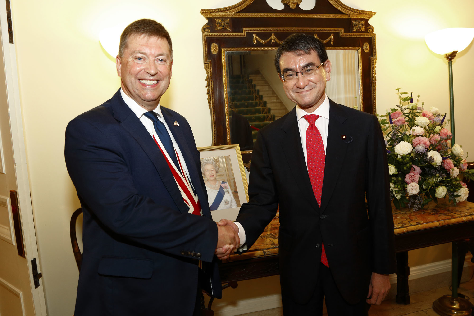 British Ambassador Paul Madden (left) welcomes Foreign Minister Taro Kono to the ambassador's residence in Chiyoda Ward to celebrate Her Majesty Queen Elizabeth II's 93rd birthday on April 25.      courtesy of the british embassy / jun takagi | 