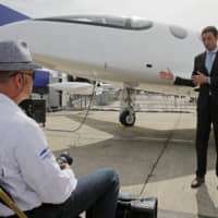 Omer Bar-Yohay, Eviation CEO and co-founder, gestures as he speaks during a media conference next to his prototype electric aircraft at the Paris Air Show, in Le Bourget, east of Paris, Tuesday. Israeli startup Eviation displayed an all-electric airplane prototype dubbed Alice, as the aviation industry increasingly looks to electric and hybrid technology because of pressure from regulators and the public to reduce emissions. | AP