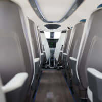 Passenger seats stand behind the open-plan cockpit of an Alice\'electric aircraft manufactured by Eviation Aircraft Ltd., during the 53rd International Paris Air Show at Le Bourget, in Paris on Tuesday. | BLOOMBERG