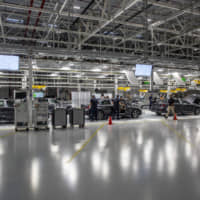 Employees work on the assembly floor at the Bayerische Motoren Werke AG (BMW) manufacturing facility in San Luis Potosi, Mexico, on Thursday. BMW AG executives are cutting the ribbon on the automaker\'s first Mexican assembly plant, a week after President Donald Trump threw a wrench in their plans with a fresh tariff threat on Mexican goods. | BLOOMBERG