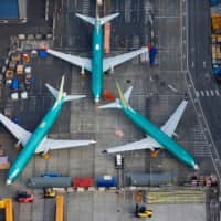 Boeing 737 MAX airplanes sit on the tarmac at the Boeing Factory in Renton, Washington, in March. | REUTERS