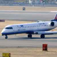 A small passenger jet of Bombardier Inc. is seen in this file photo taken in 2012 at Osaka International Airport. | KYODO
