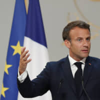 French President Emmanuel Macron gestures as he delivers a speech at the Elysee Palace during a ceremony marking the 50th anniversary of President Georges Pompidou\'s presidential victory, in Paris on Wednesday. | AFP-JIJI