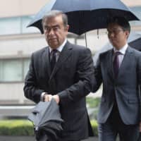 Former Nissan Motor Co. Chairman Carlos Ghosn arrives for a pretrial hearing at the Tokyo District Court on Monday. | AFP-JIJI