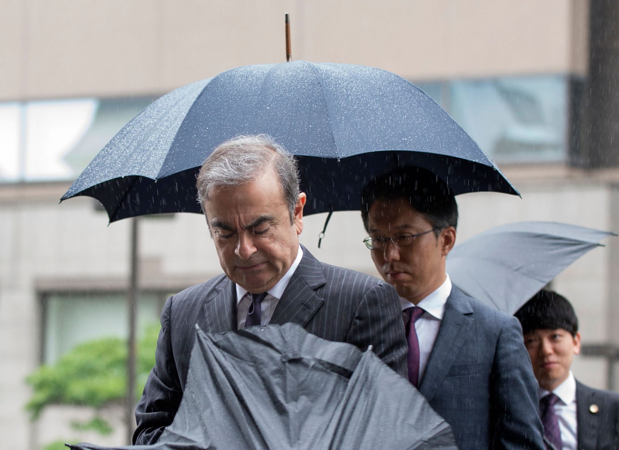 Former Nissan Motor Chairman Carlos Ghosn arrives for a pre-trial hearing at the Tokyo District Court on Monday. | AFP-JIJI