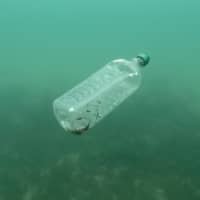 A plastic bottle is seen floating in an Adriatic sea off the island Mljet, Croatia, in 2018. | REUTERS