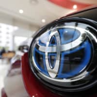 Toyota cars are displayed at a Toyopet dealership in Tokyo\'s Minato Ward. | KYODO