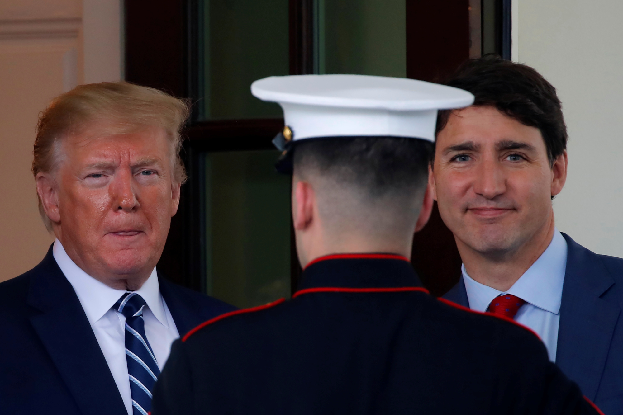 Canadian Prime Minister Justin Trudeau (right) leaves after a meeting with U.S. President Donald Trump at the Oval Office of the White House in Washington Thursday. | REUTERS