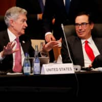 U.S. Federal Reserve Chairman Jerome Powell talks with U.S. Treasury Secretary Steven Mnuchin during the G20 finance ministers and central bank governors meeting in Fukuoka on Saturday. | REUTERS