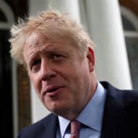 Prime minister hopeful Boris Johnson leaves his home in London June 17. | REUTERS