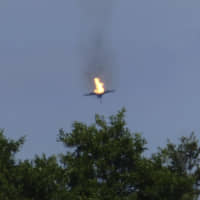 A burning Eurofighter airplane crashes near the village of Malchow in northern Germany Monday. Two unarmed fighter jets collided on Monday near Lake Mueritz, 100 km north of Berlin. | THOMAS STEFFAN / DPA / VIA AP