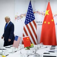 U.S. President Donald Trump and Chinese President Xi Jinping attend a bilateral meeting on the sidelines of the G20 summit in Osaka on Saturday. | AFP-JIJI