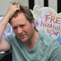 Richard Ratcliffe, husband of British-Iranian woman Nazanin Zaghari-Ratcliffe who is imprisoned in Iran, is seen during his hunger strike outside the Iranian Embassy in London last Tuesday. | AFP-JIJI