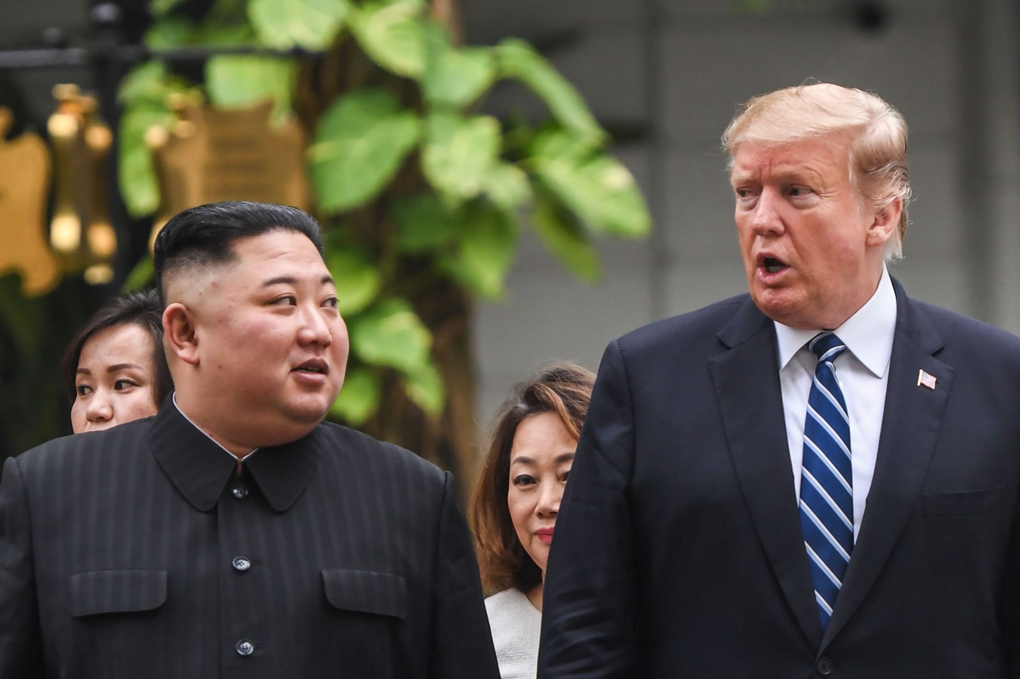 U.S. President Donald Trump walks with North Korean leader Kim Jong Un during a break in talks at the second U.S.-North Korea summit at the Sofitel Legend Metropole hotel in Hanoi in late February. | AFP-JIJI