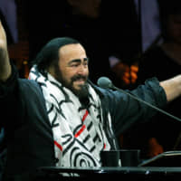 Italian opera star Luciano Pavarotti gestures during part of his round-the-world farewell tour concerts in Shanghai in 2005. | REUTERS