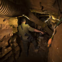 An Israeli soldier walks inside a tunnel that the army says crosses from Lebanon to Israel, in Zarit, northern Israel, Monday. The Israeli military says it has finished sealing the last of a series of Hezbollah attack tunnels under the country\'s northern border with Lebanon, roughly six months after they were found. | AP