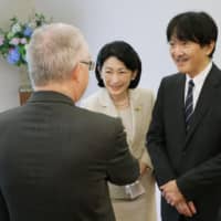 Crown Prince Akishino and Crown Princess Kiko greet an ambassador in Tokyo on Thursday morning before leaving for Europe the same day. | POOL / VIA KYODO