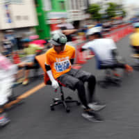 Racers compete during ISU-1 Hanyu Grand Prix, while taking part in the office chair race ISU-1 Grand Prix series, in Hanyu, north of Tokyo. | REUTERS